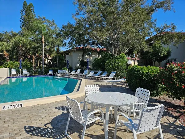 a view of a swimming pool with a patio