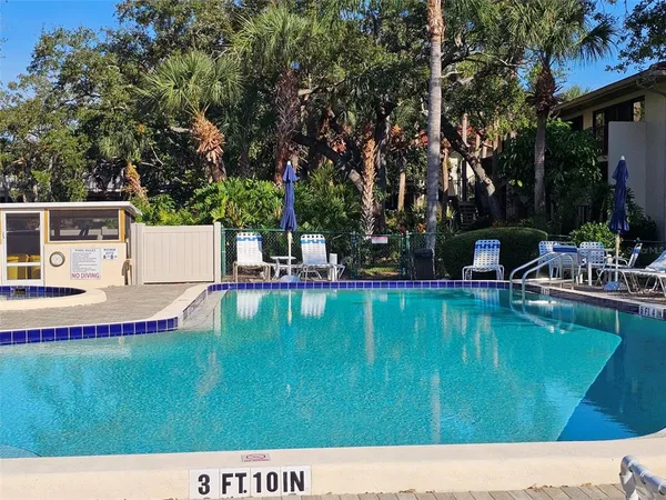 a view of swimming pool with a patio