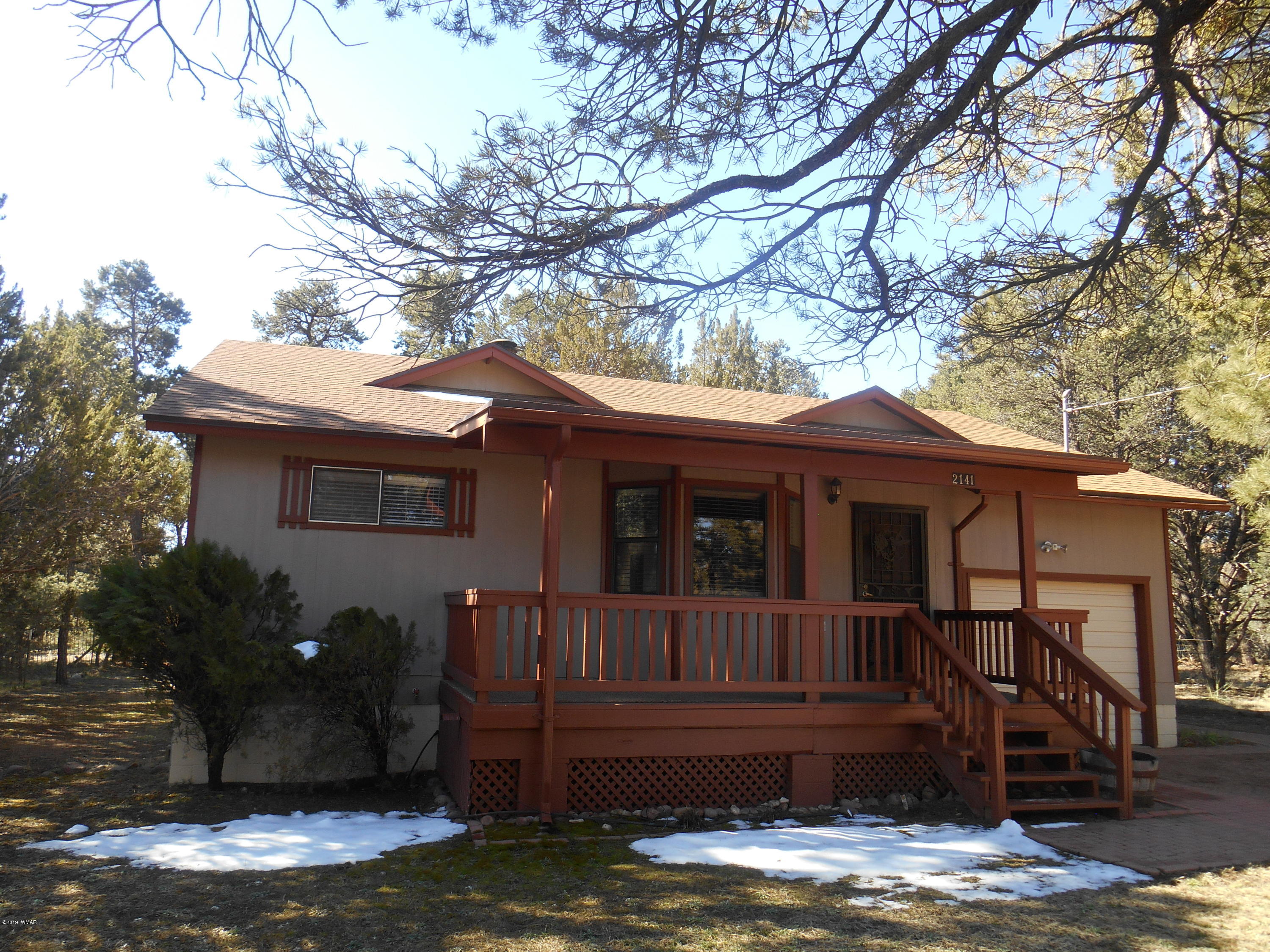 2141 Wildflower Road Overgaard, AZ 85933 - Photo 1 of 21 a view of house with yard porch and entertaining space