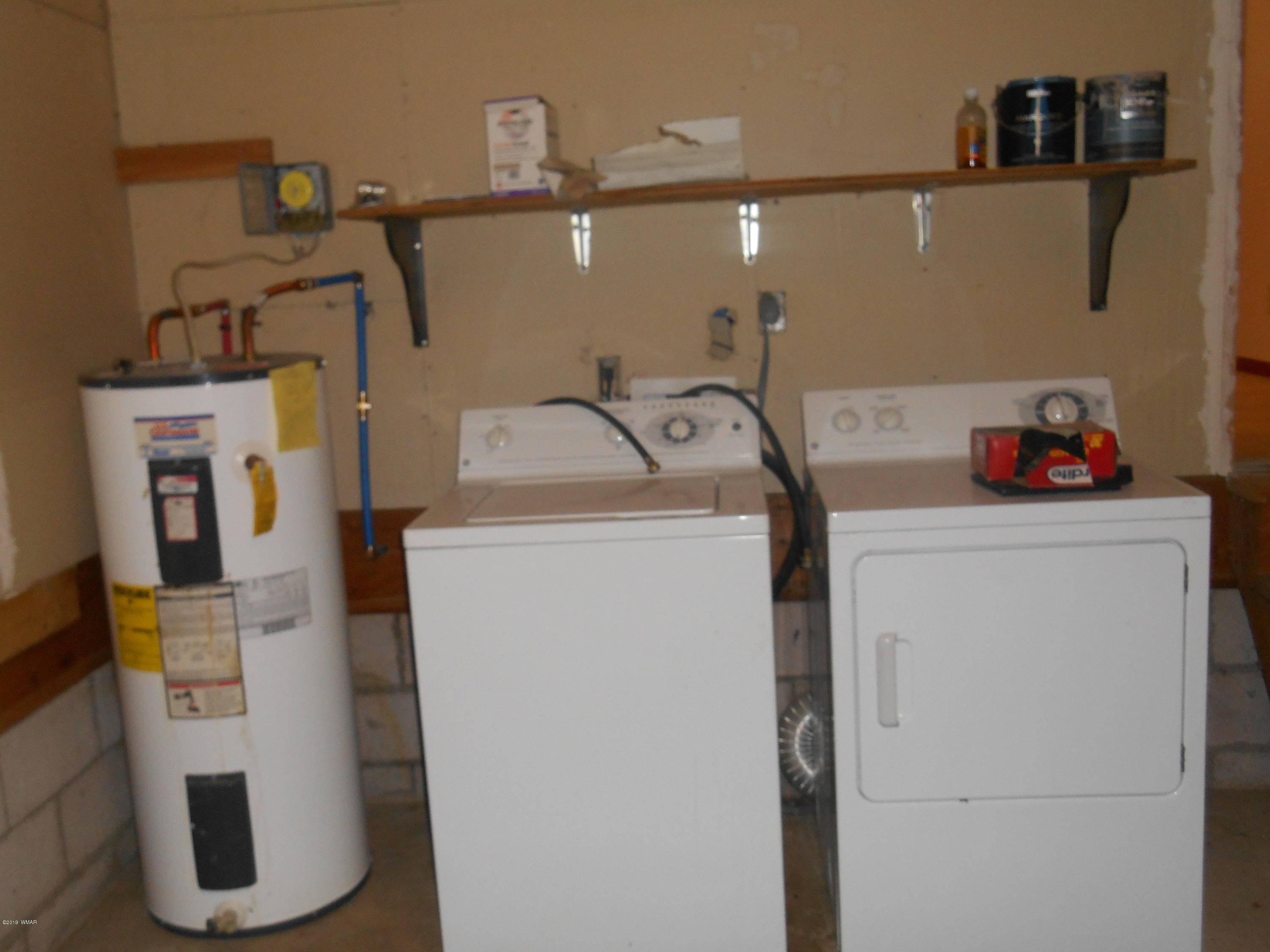 2141 Wildflower Road Overgaard, AZ 85933 - Photo 12 of 21 a utility room with dryer and washer