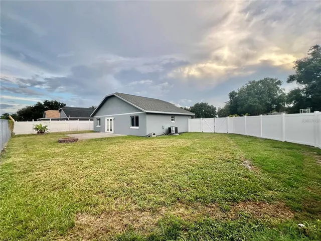 a swimming pool with wooden fence