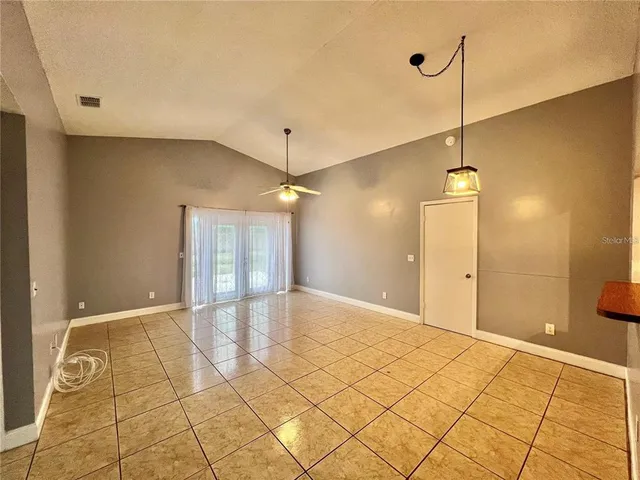 a view of an empty room and window