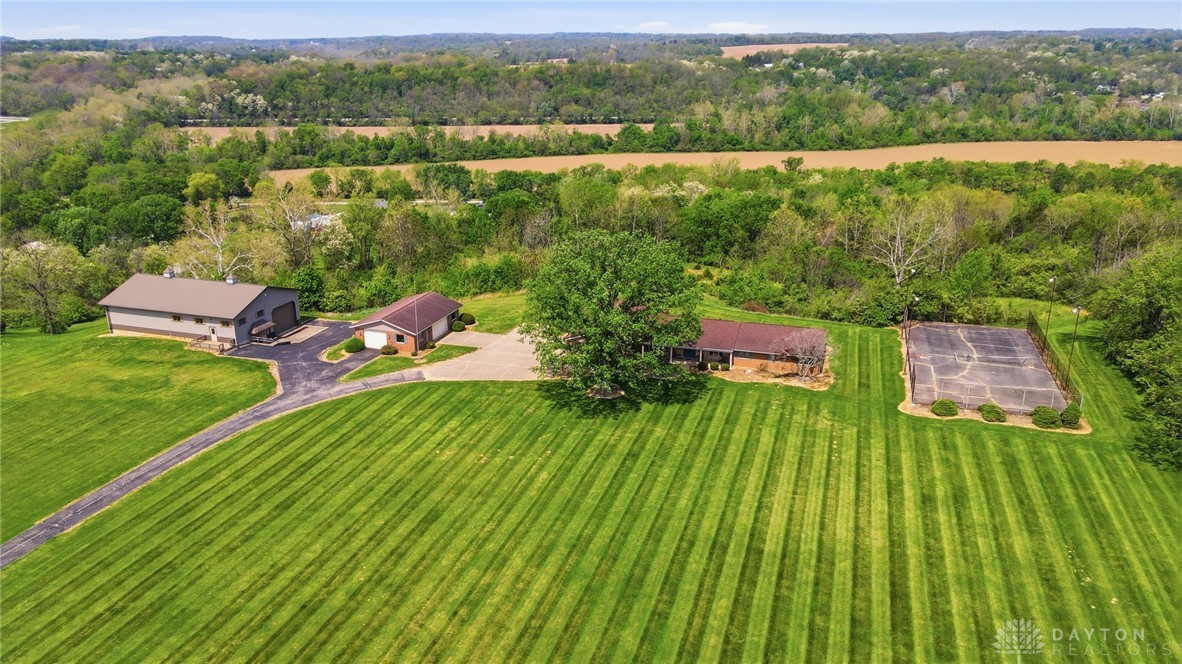 5669 O Neall Road Waynesville, OH 45068 - Photo 7 of 72 Expansive acreage boasts a residence, a secondary building, and a private tennis court.