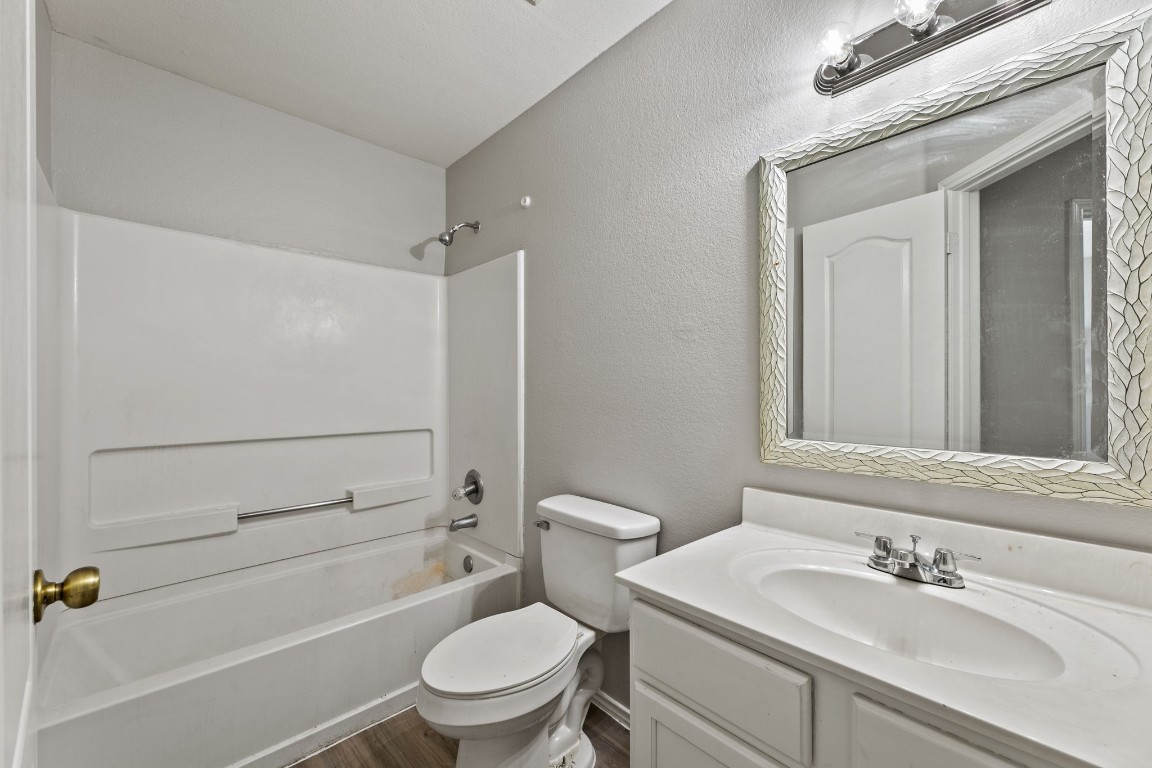 1308 Water Spaniel Way Round Rock, TX 78664 - Photo 12 of 25 a bathroom with a sink toilet and shower