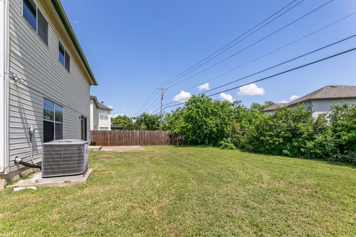 1308 Water Spaniel Way Round Rock, TX 78664 - Photo 22 of 25 a view of backyard with garden and deck