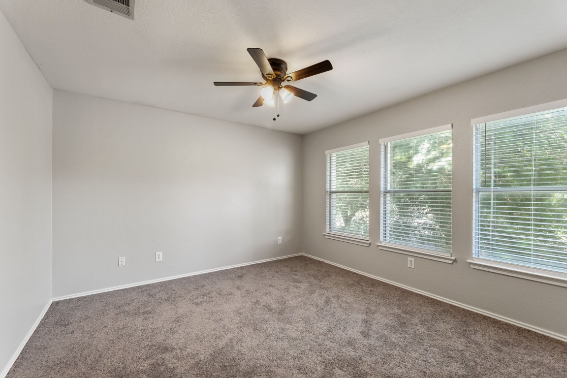 1308 Water Spaniel Way Round Rock, TX 78664 - Photo 10 of 25 a view of an empty room with a window