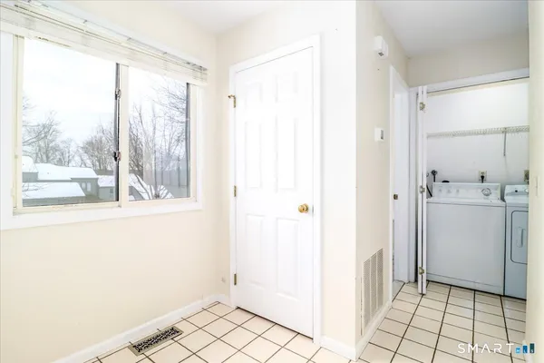 a view of a bathroom with a sink and a window