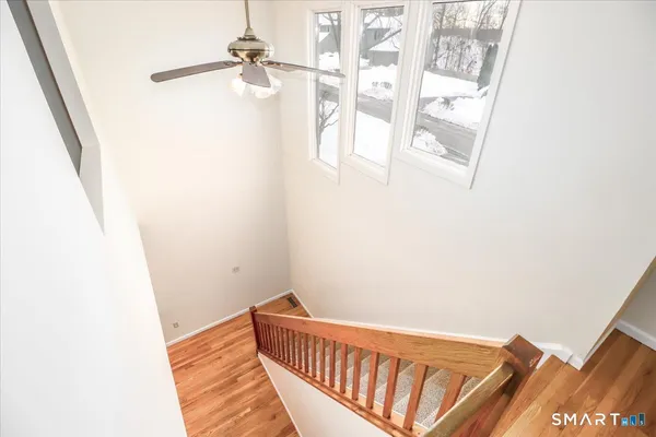 a view of a hallway with windows