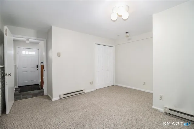 an empty room with a bathroom