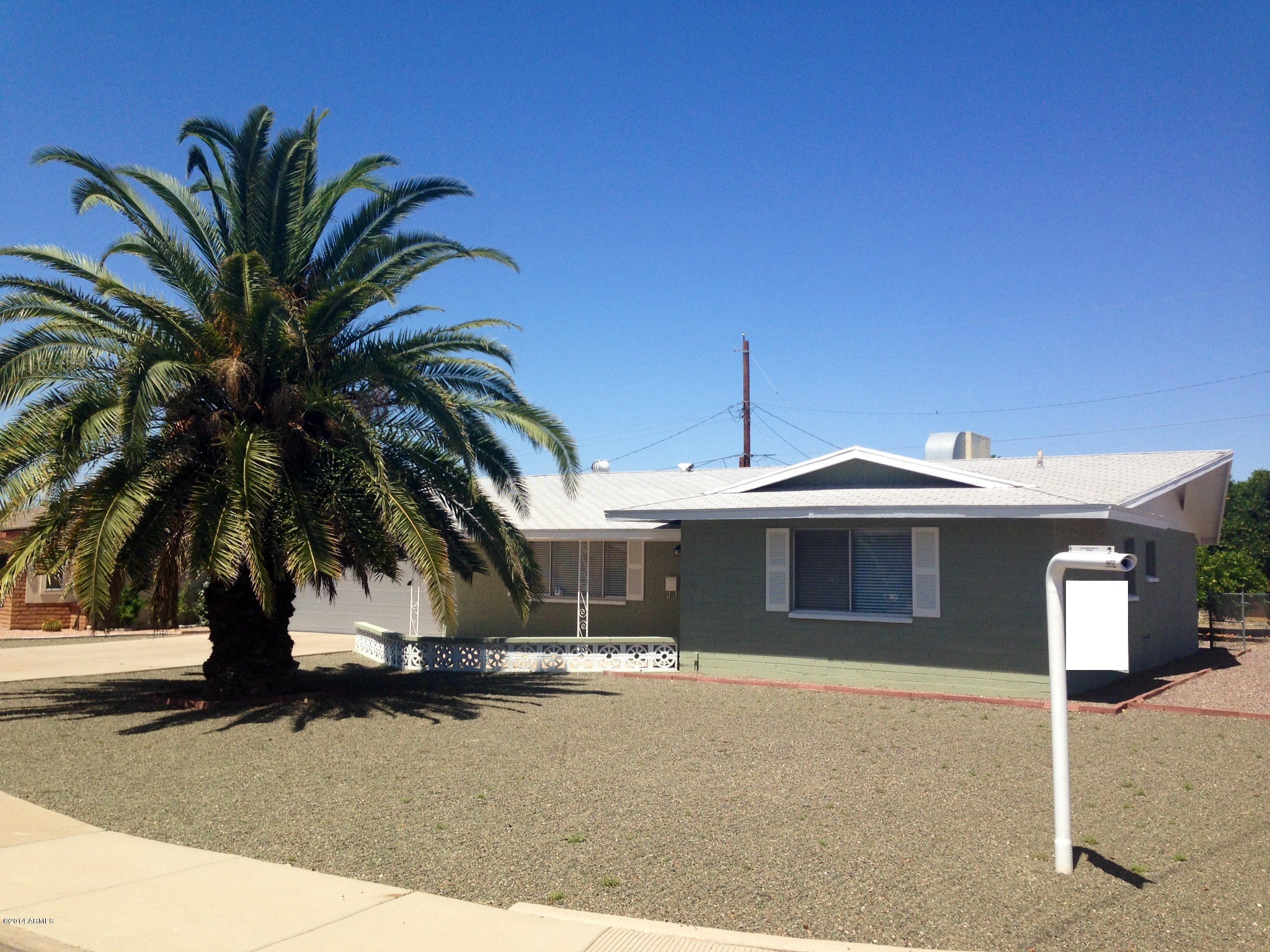 5740 Covina Road Mesa, AZ 85205 - Photo 1 of 19 a front view of a house with a yard