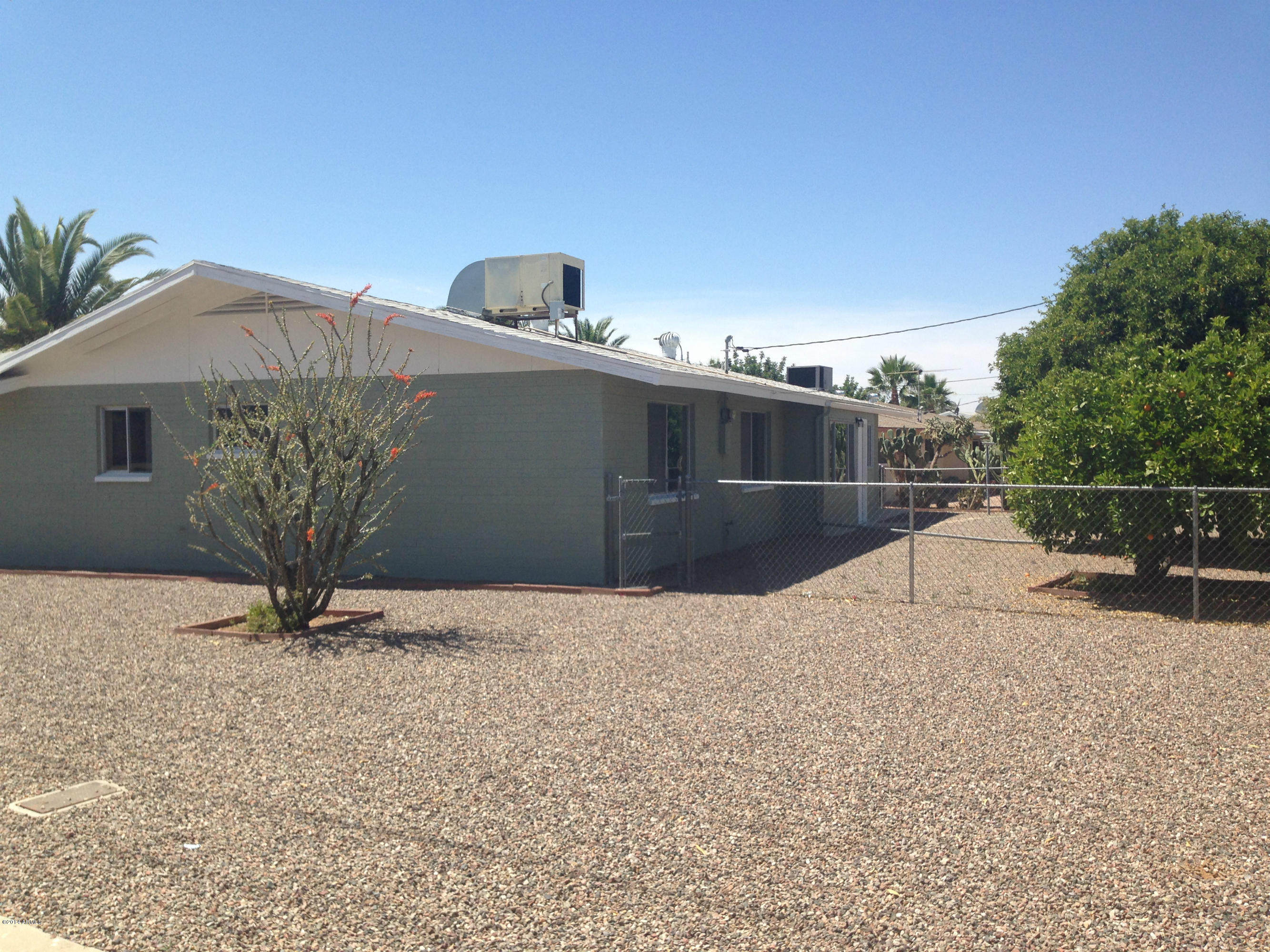5740 Covina Road Mesa, AZ 85205 - Photo 14 of 19 a view of roof deck with wooden fence