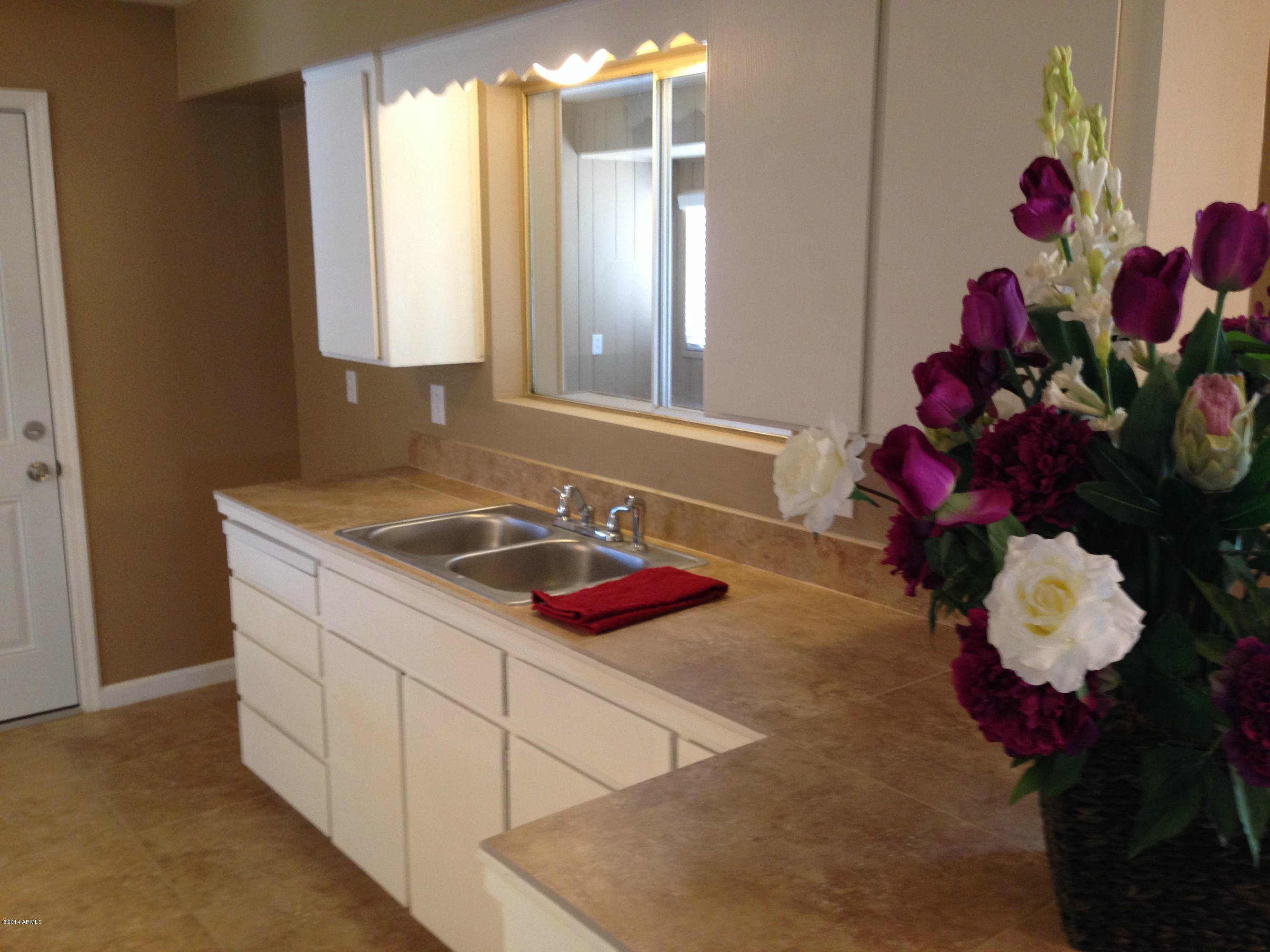 5740 Covina Road Mesa, AZ 85205 - Photo 7 of 19 a bathroom with a sink mirror and vanity