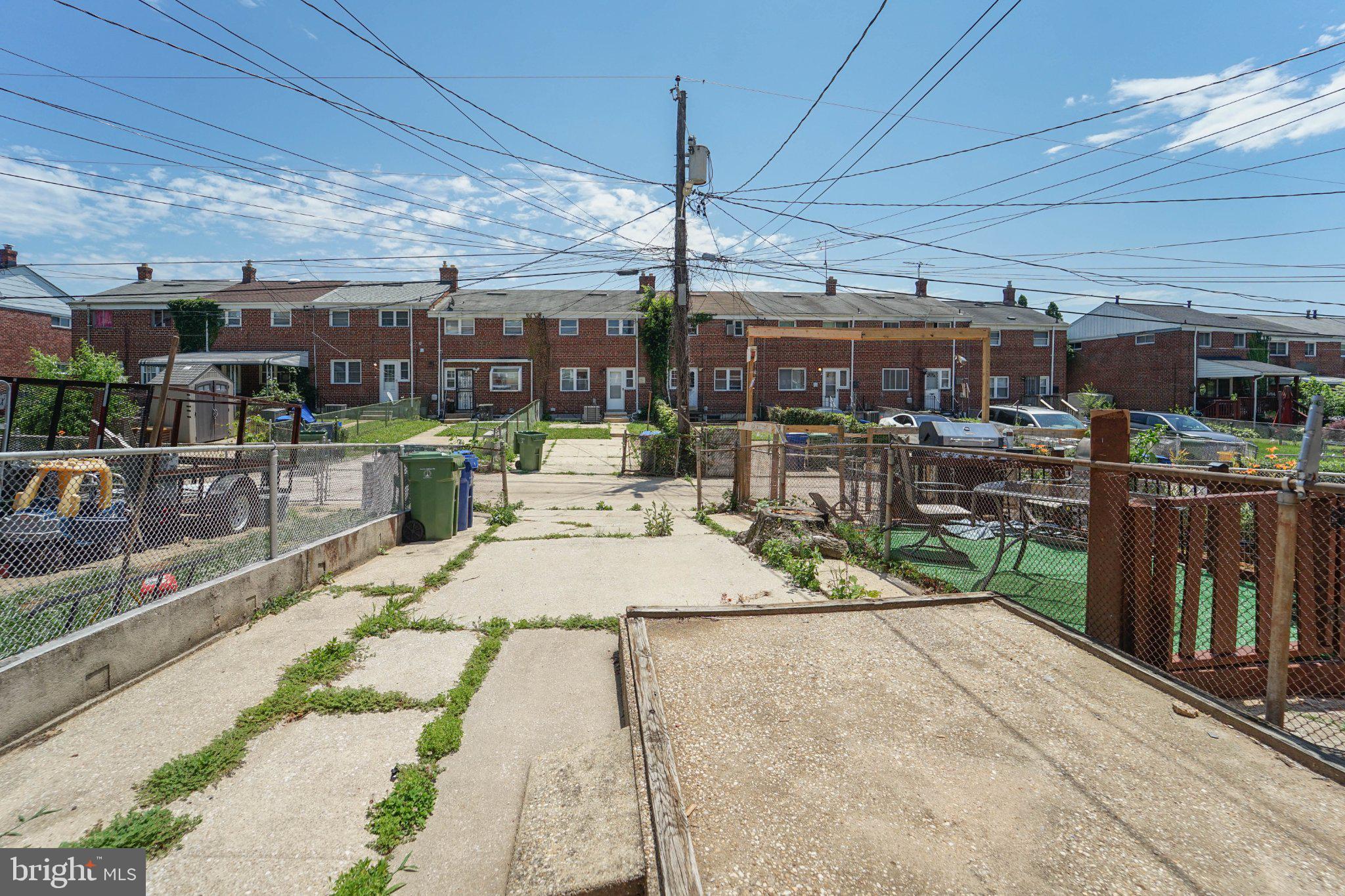 643 South Wickham Road Baltimore, MD 21229 - Photo 2 of 32 Urban landscape with open pathways.