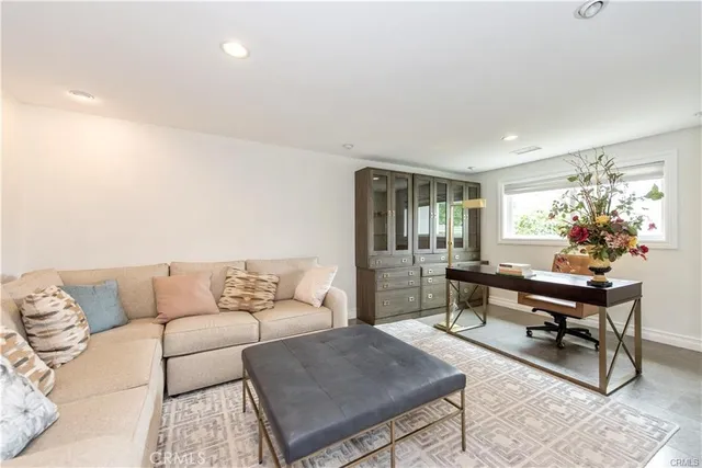 a bathroom with a double vanity sink toilet mirror and bathtub