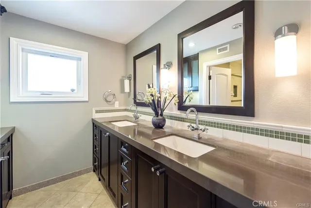 a spacious bedroom with a bed and a couch