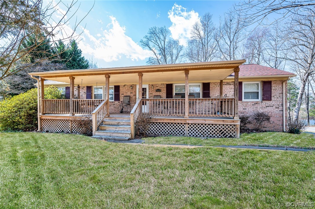 5118 Hackney Road Richmond, VA 23234 - Photo 2 of 17 a view of a house with a yard and deck