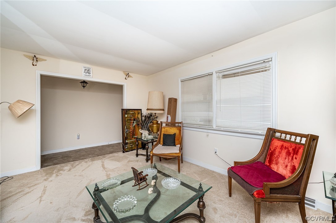 5118 Hackney Road Richmond, VA 23234 - Photo 5 of 17 a living room with furniture and a chair