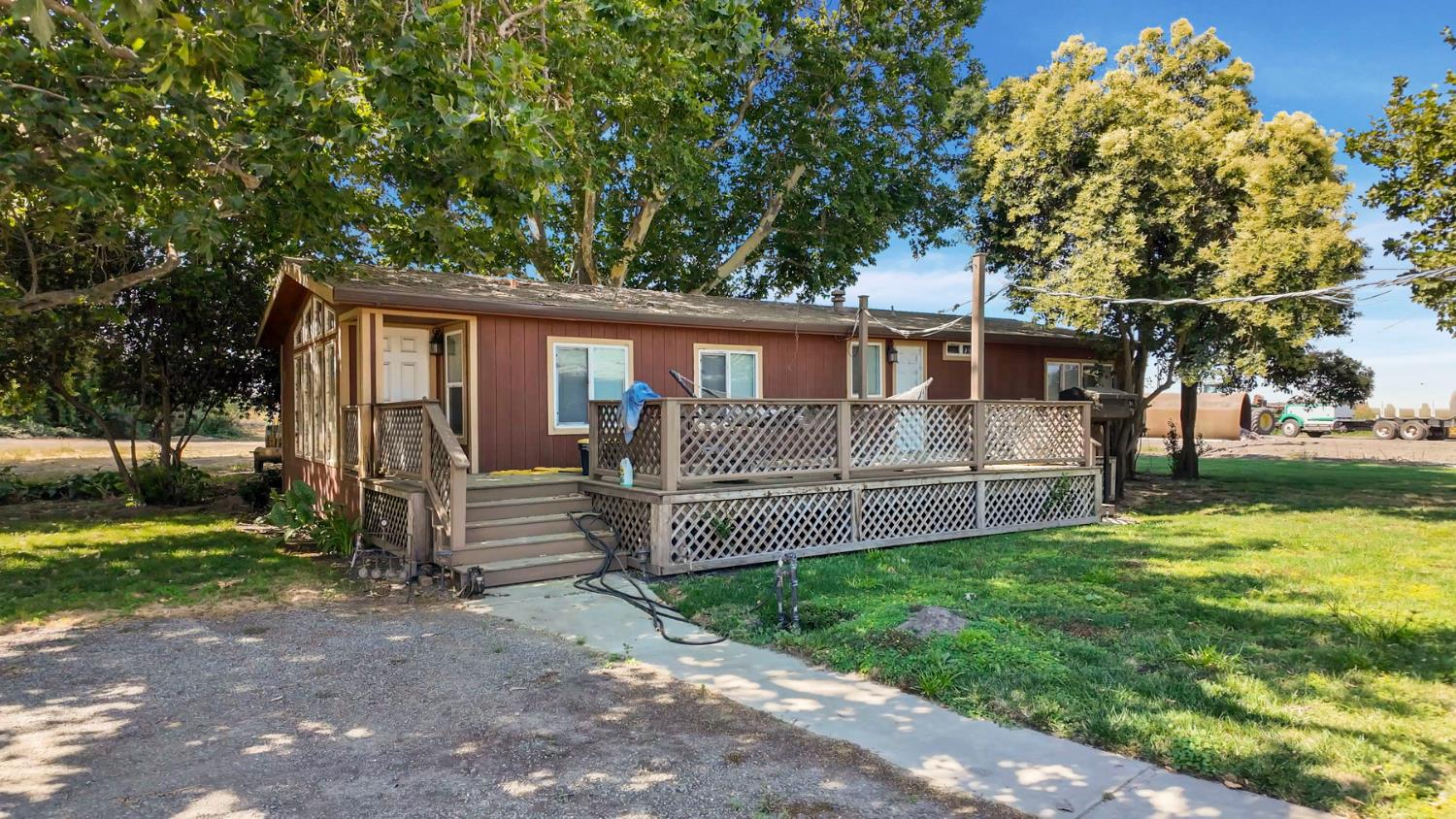 19701 Tyler Island Road Walnut Grove, CA 95690 - Photo 50 of 53 a front view of a house with a garden