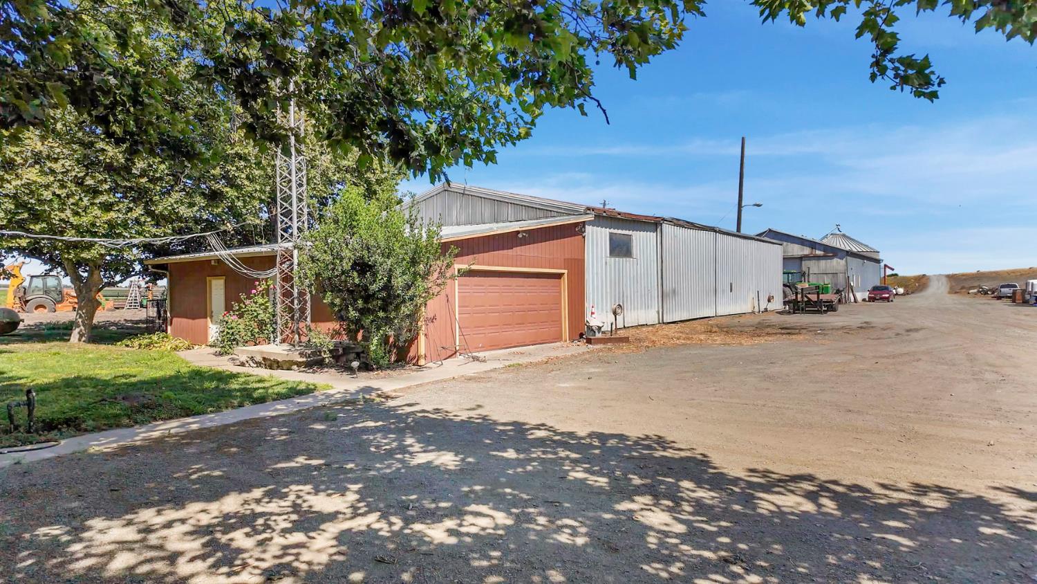 19701 Tyler Island Road Walnut Grove, CA 95690 - Photo 52 of 53 a view of a house with a yard and garage
