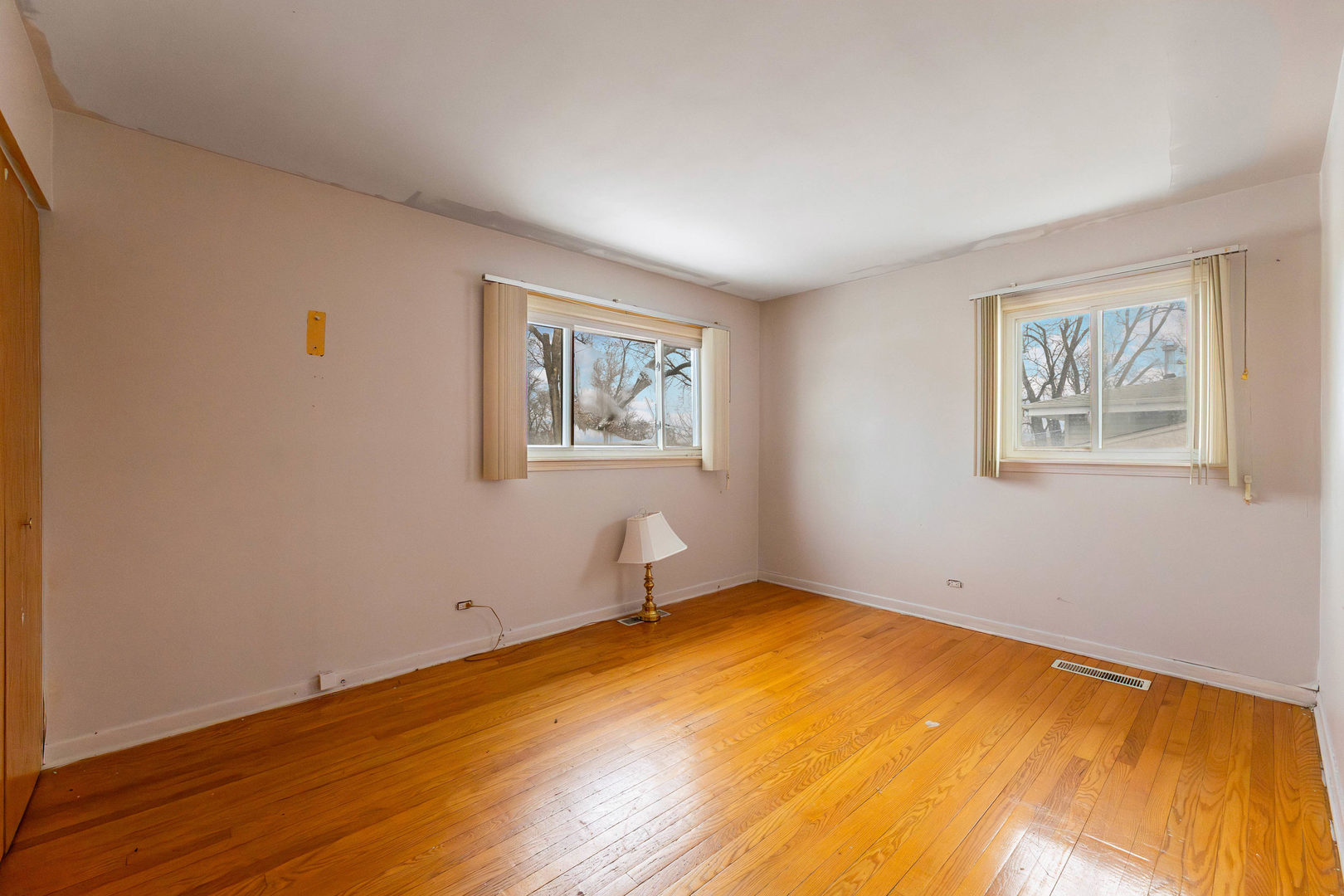 212 Berry Street Park Forest, IL 60466 - Photo 8 of 10 a room with a wooden floor and a window