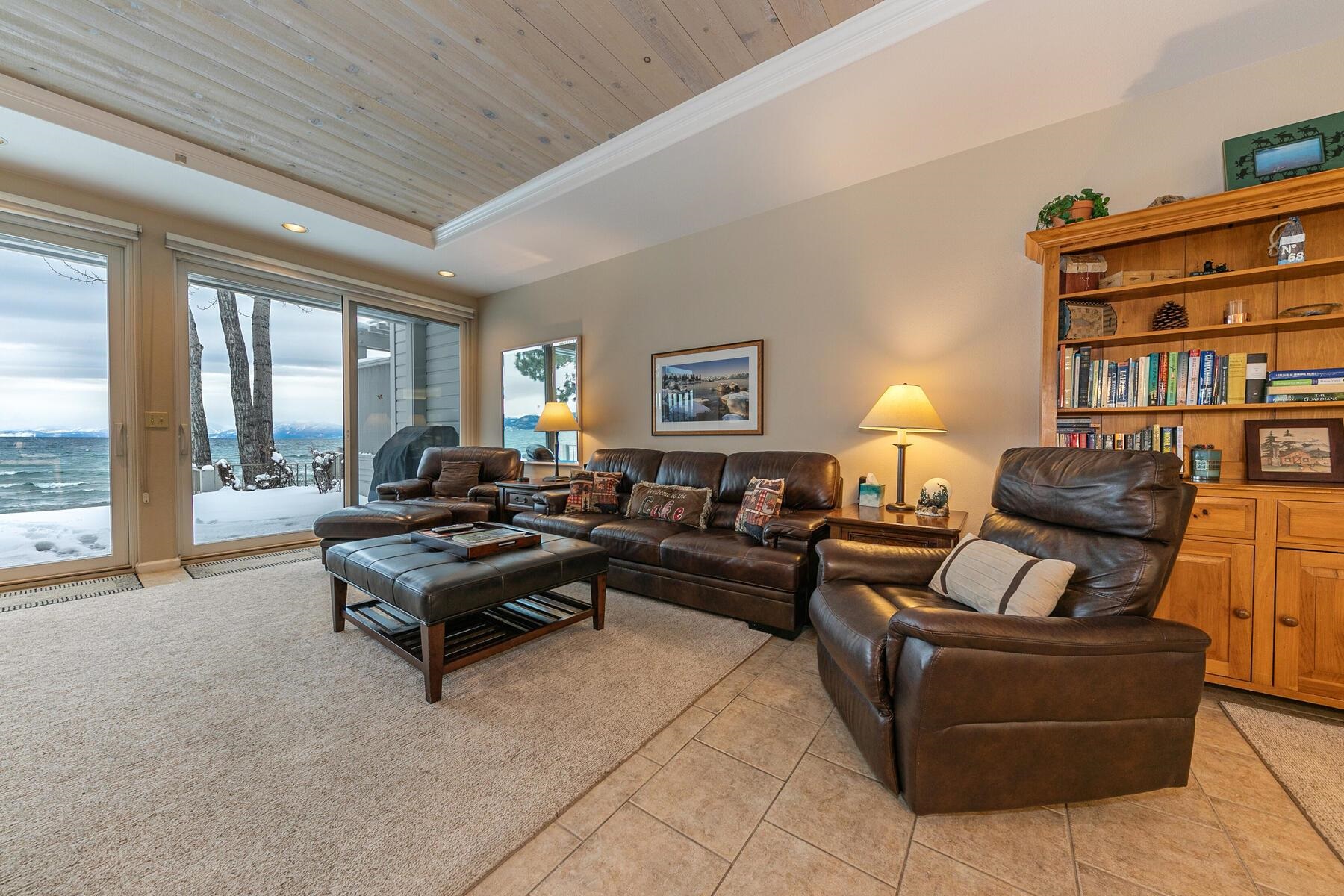 8000 North Lake Boulevard, Unit 5 Kings Beach, CA 96143 - Photo 11 of 28 a living room with furniture a large window and a flat screen tv