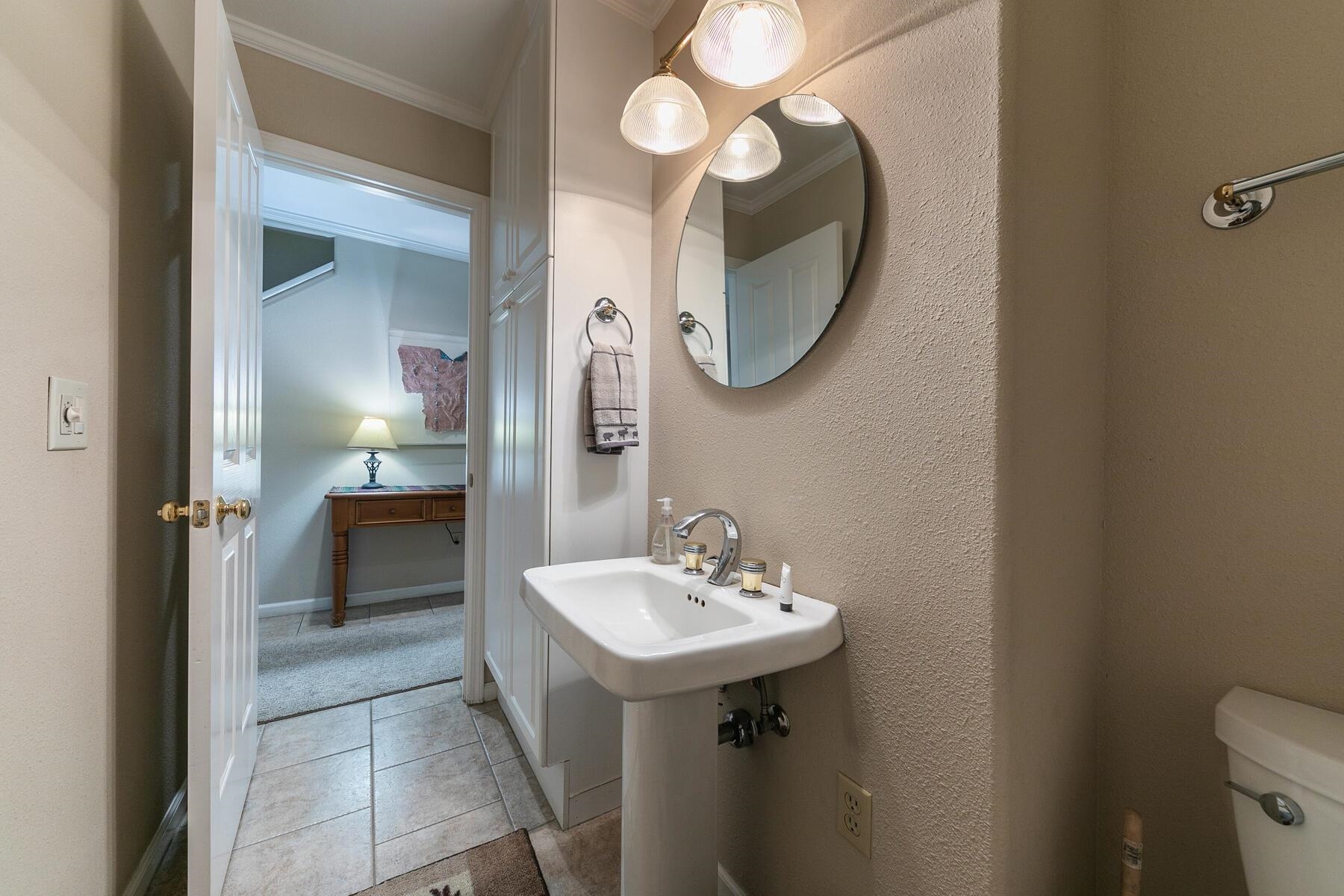 8000 North Lake Boulevard, Unit 5 Kings Beach, CA 96143 - Photo 14 of 28 a bathroom with a sink and a mirror