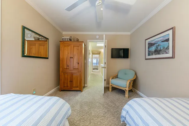 a bedroom with a bed and a chair