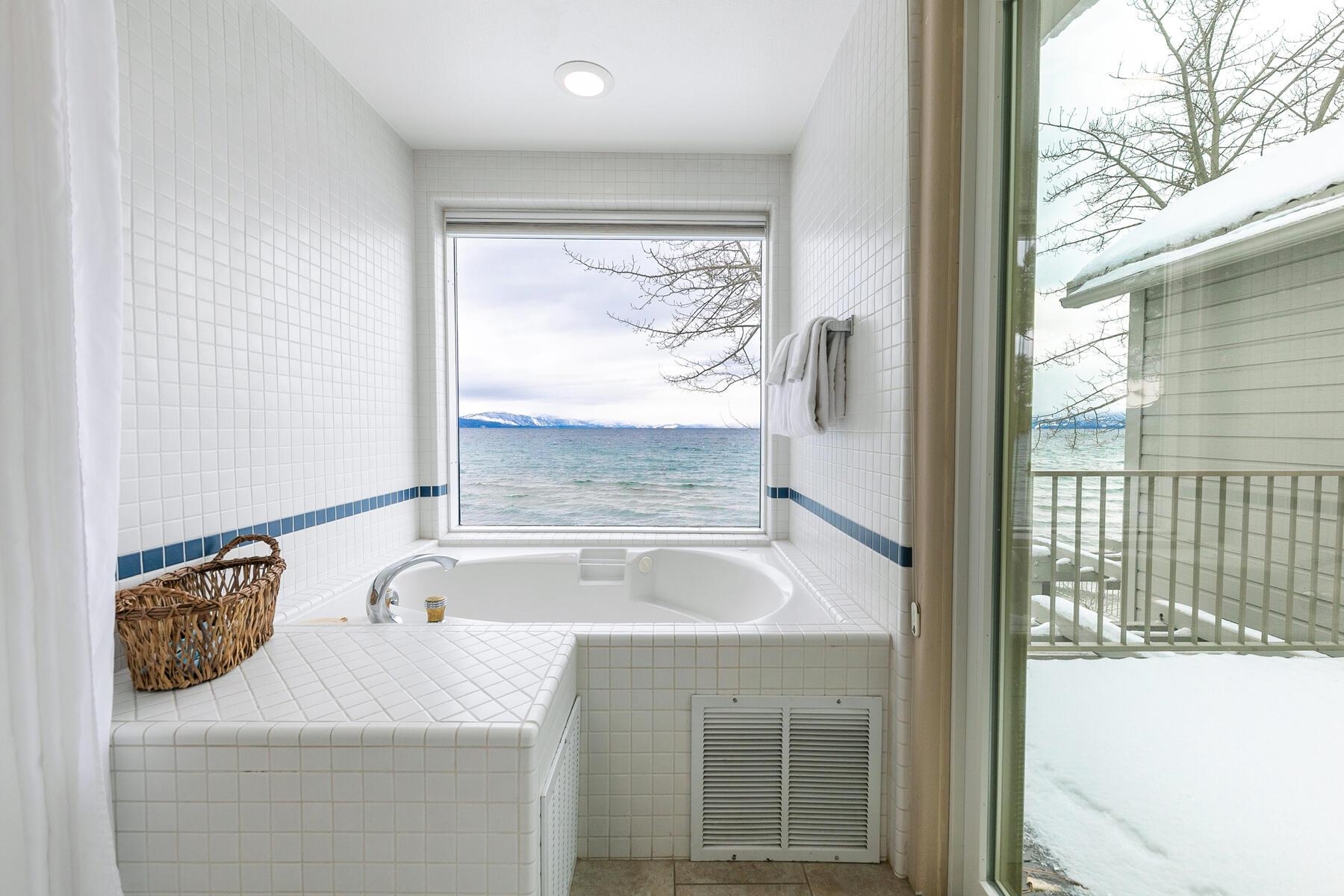 8000 North Lake Boulevard, Unit 5 Kings Beach, CA 96143 - Photo 24 of 28 a bathroom with a granite countertop sink and bathtub