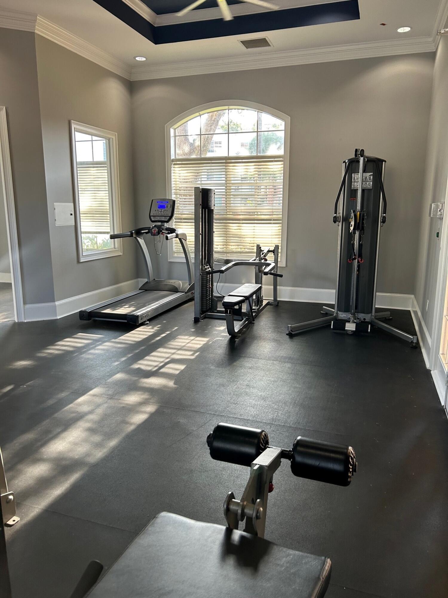 9825 Baywinds Boulevard, Unit 1206 Royal Palm Beach, FL 33411 - Photo 16 of 22 a room with gym equipment and a large window