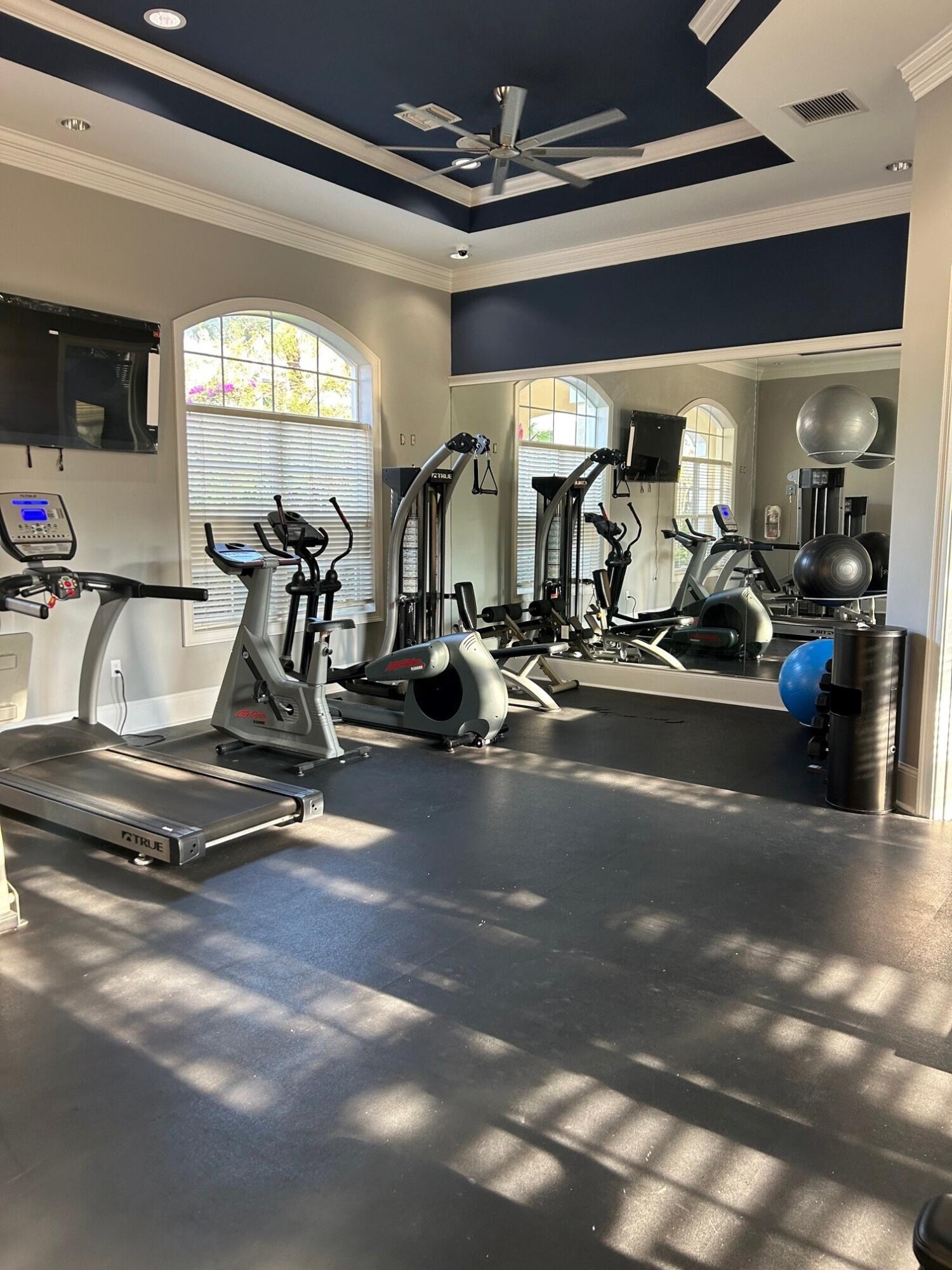 9825 Baywinds Boulevard, Unit 1206 Royal Palm Beach, FL 33411 - Photo 17 of 22 a view of a room with gym equipment