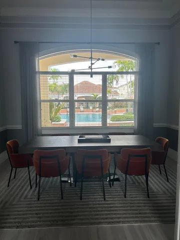 a room with a table and chairs