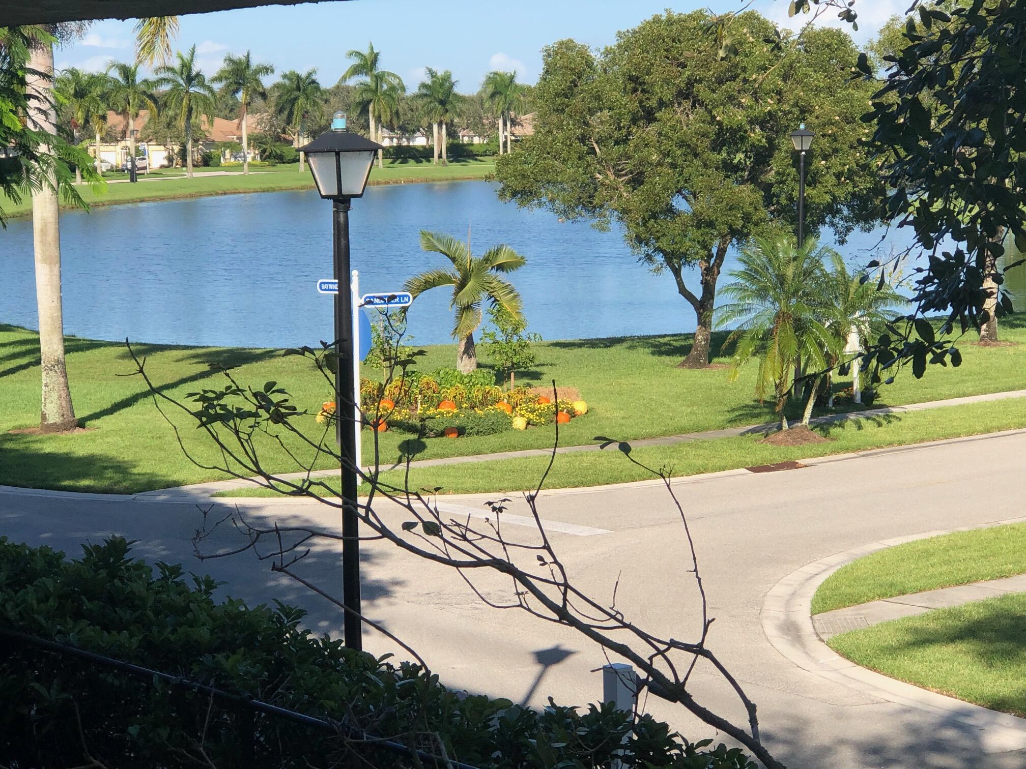 9825 Baywinds Boulevard, Unit 1206 Royal Palm Beach, FL 33411 - Photo 20 of 22 an aerial view of a house with a swimming pool