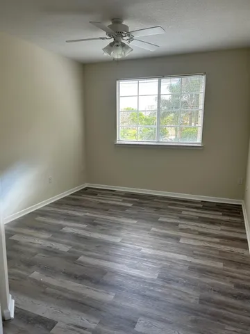 a view of an empty room with a window