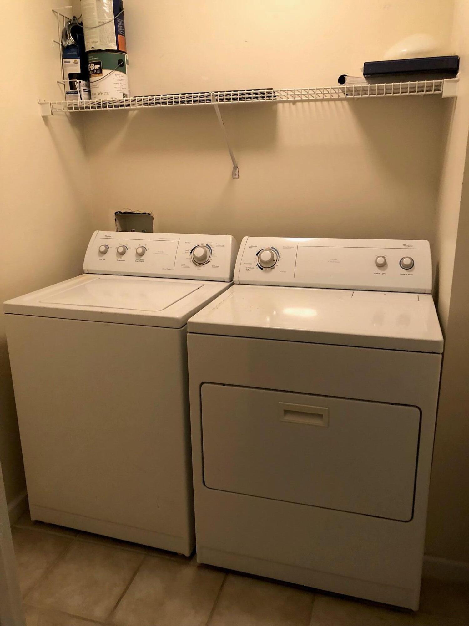 9825 Baywinds Boulevard, Unit 1206 Royal Palm Beach, FL 33411 - Photo 8 of 22 a utility room with dryer and washer