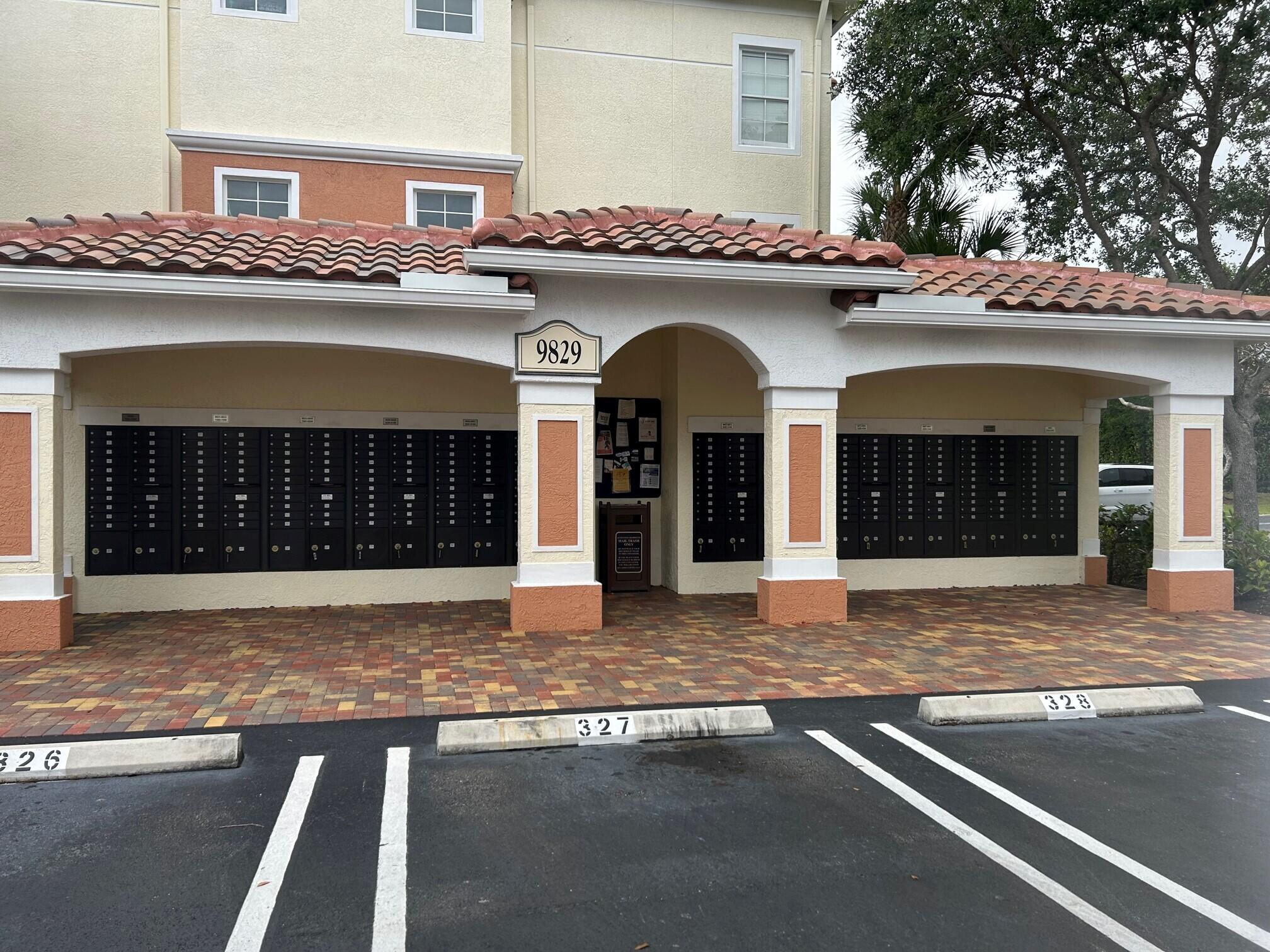 9825 Baywinds Boulevard, Unit 1206 Royal Palm Beach, FL 33411 - Photo 9 of 22 a front view of a building