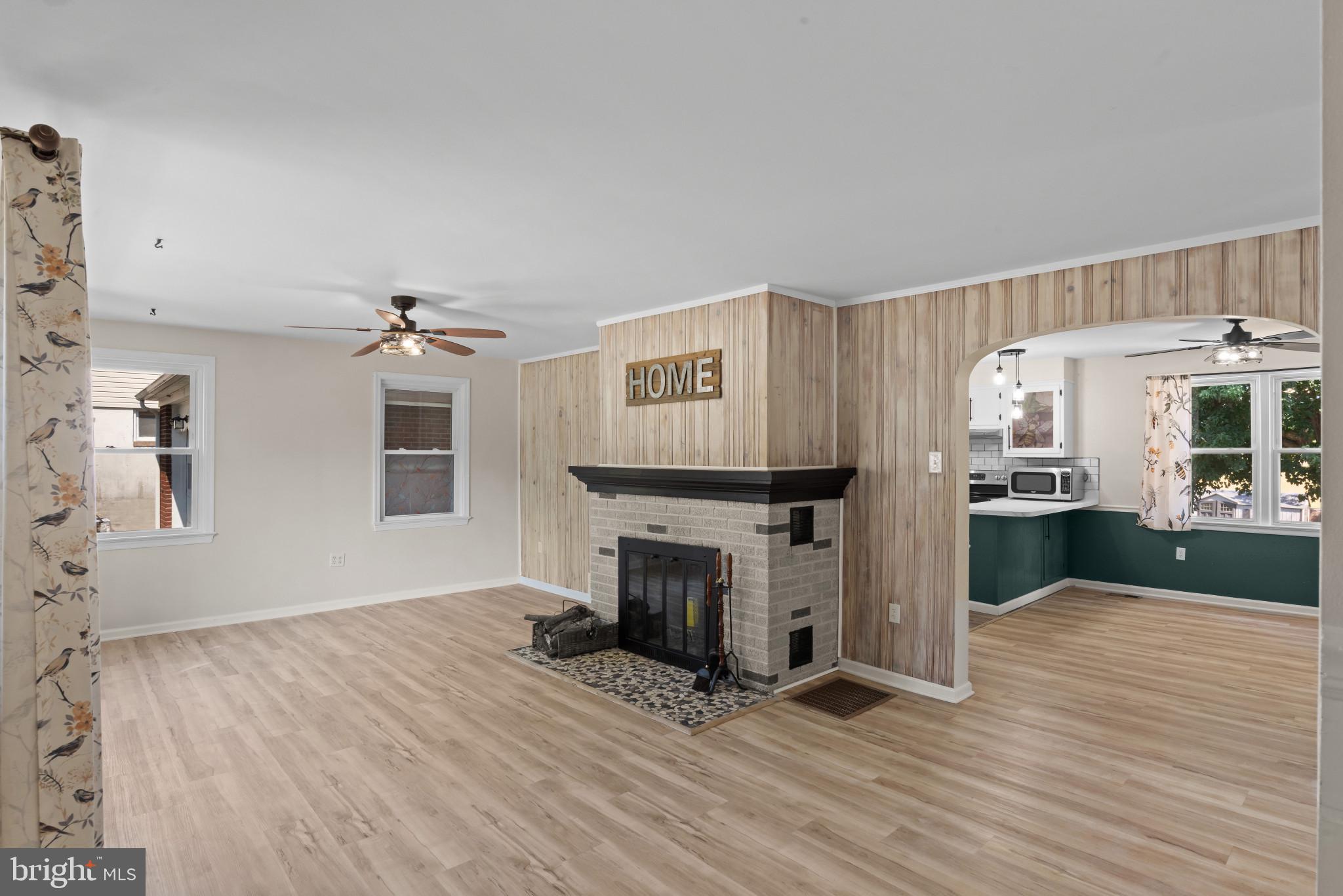 14 Sharon Road Enola, PA 17025 - Photo 5 of 40 Living area featuring a brick fireplace with a dar