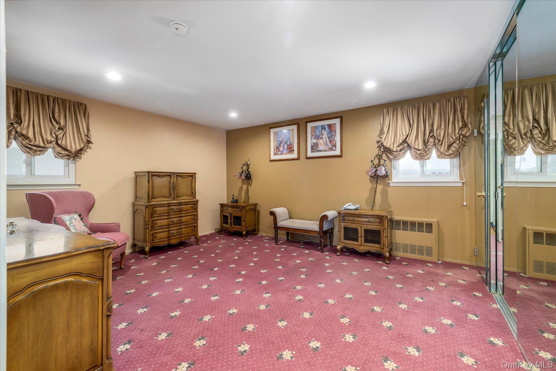 3284 Shore Road Oceanside, NY 11572 - Photo 13 of 27 a bedroom with furniture and a flat screen tv
