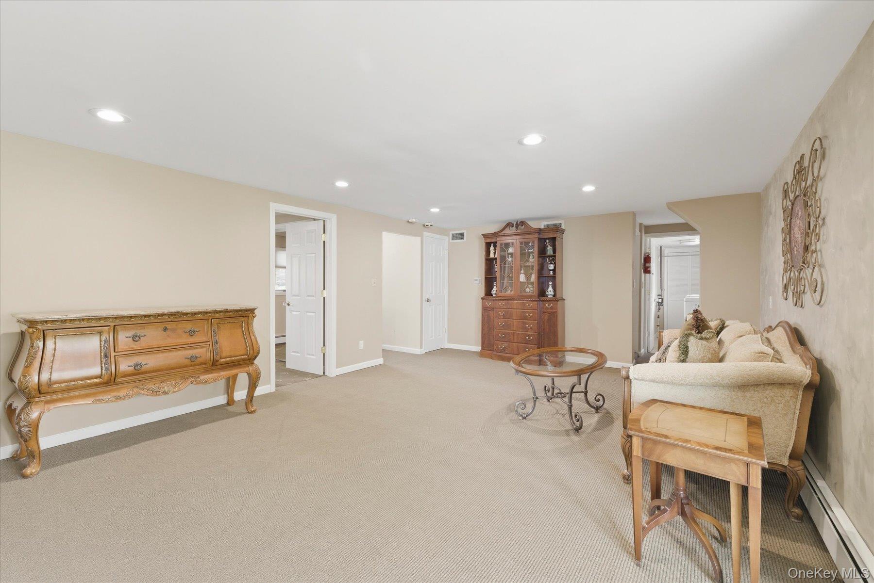 3284 Shore Road Oceanside, NY 11572 - Photo 19 of 27 a living room with furniture and a table