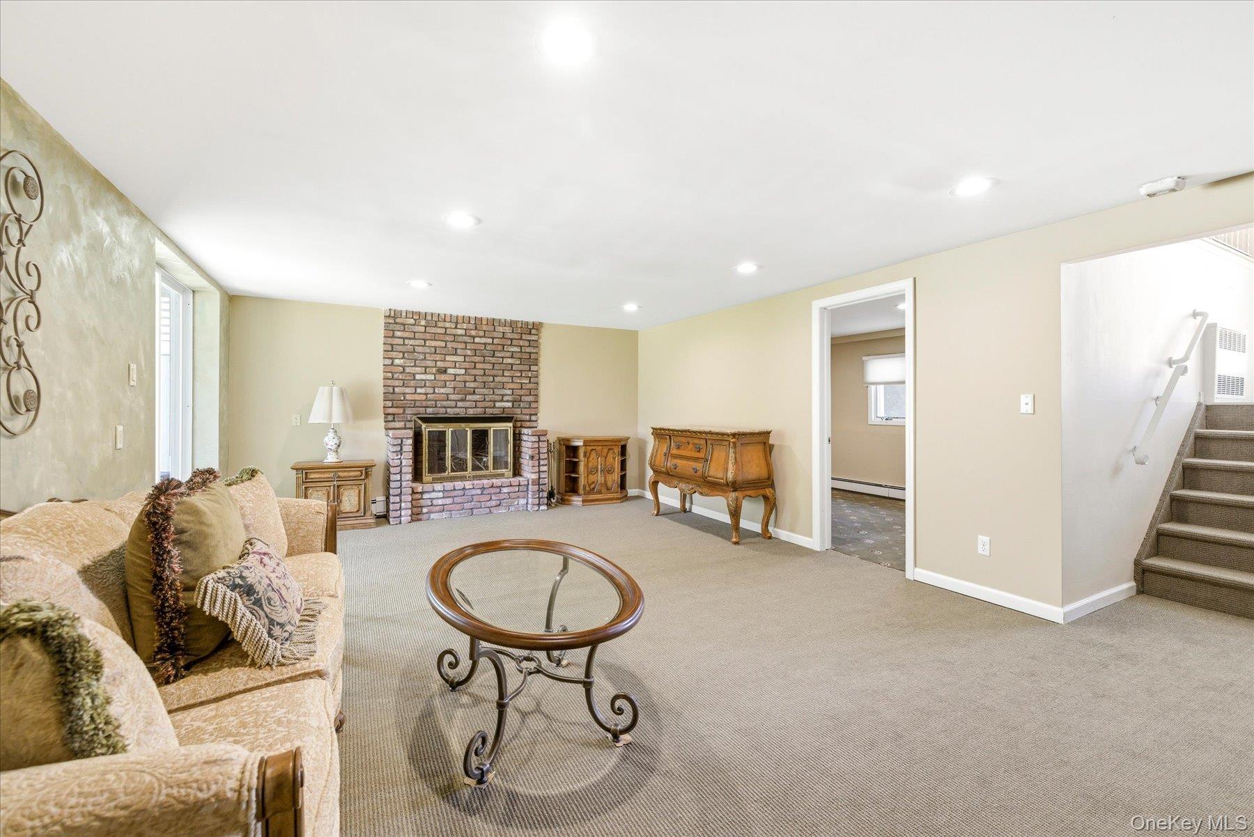 3284 Shore Road Oceanside, NY 11572 - Photo 20 of 27 a living room with furniture and a breakfast area