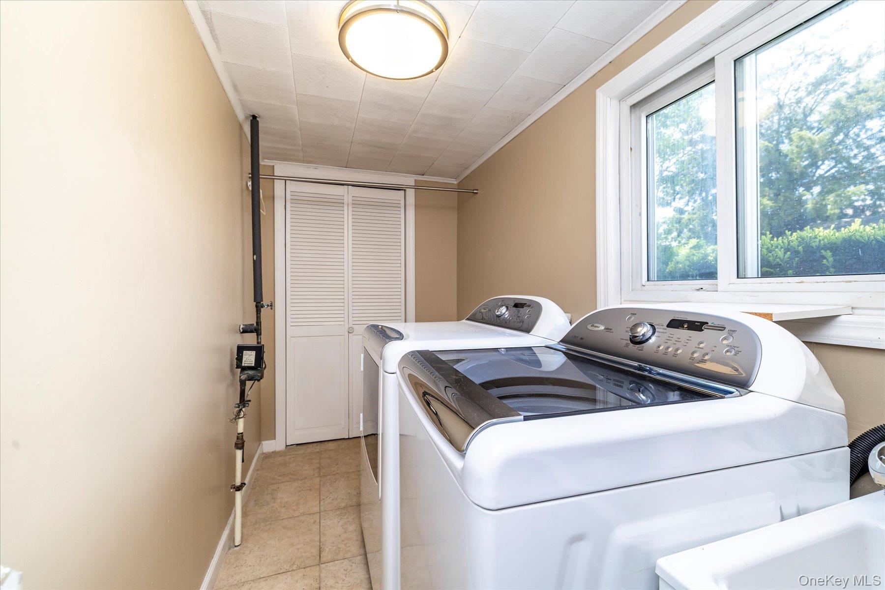 3284 Shore Road Oceanside, NY 11572 - Photo 26 of 27 a bed sitting in a bedroom next to a window