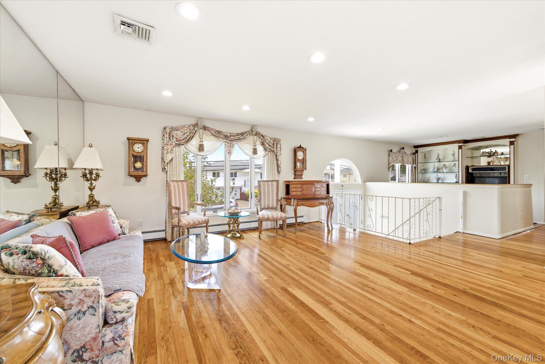 3284 Shore Road Oceanside, NY 11572 - Photo 4 of 27 a living room with furniture and a wooden floor