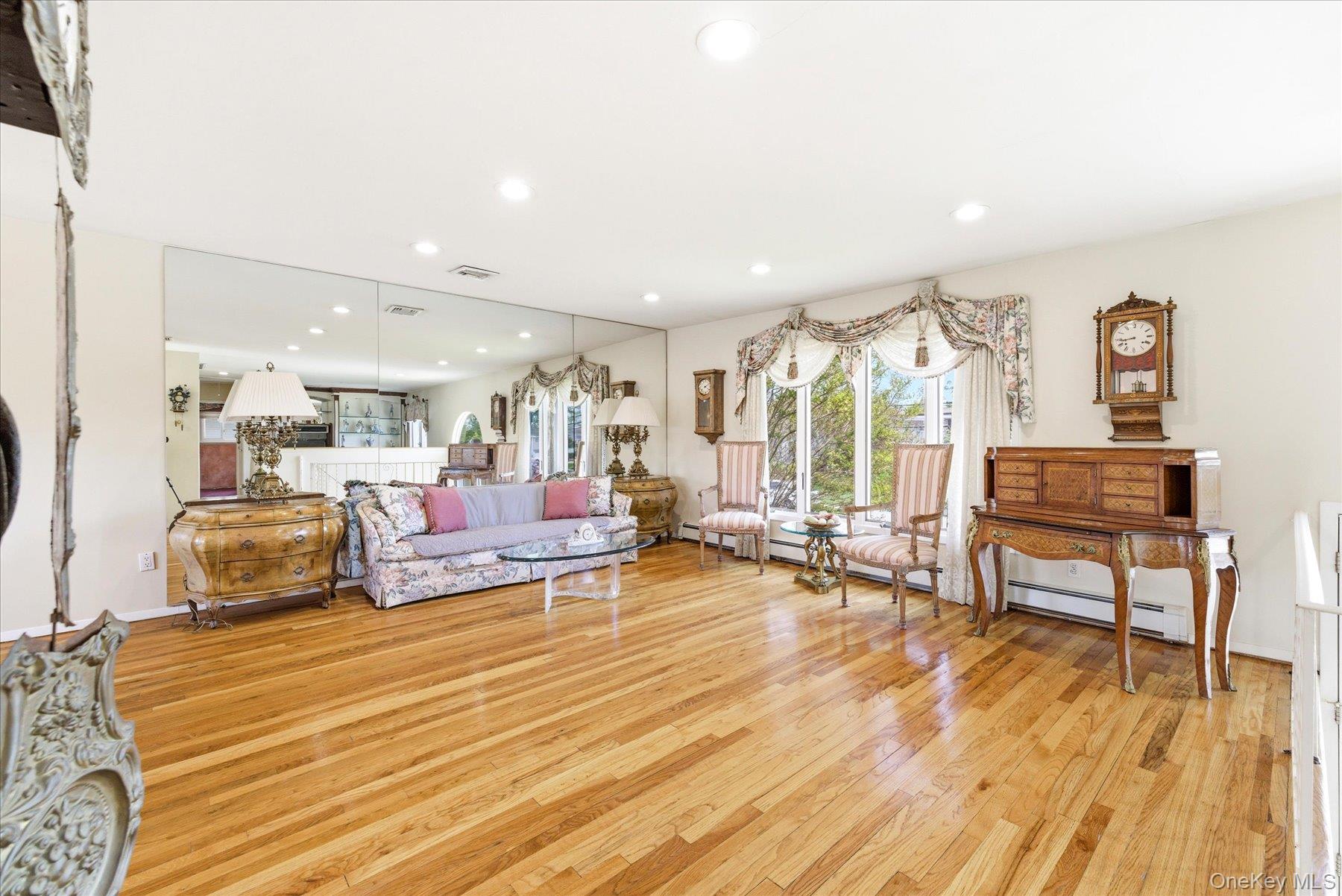3284 Shore Road Oceanside, NY 11572 - Photo 5 of 27 a living room with furniture and a wooden floor