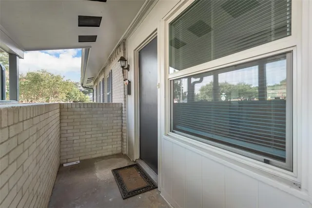 a view of a door and a window