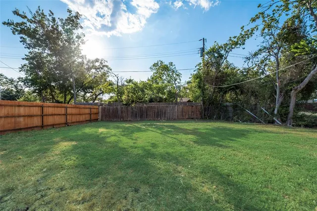 a view of backyard with green space