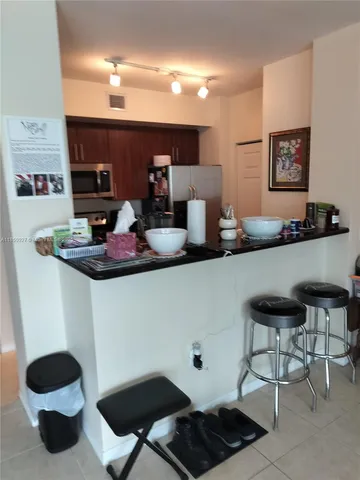 a kitchen with a dining table and chairs