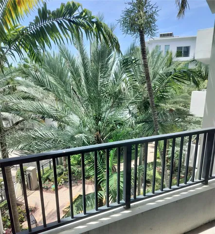 a view of balcony with yard