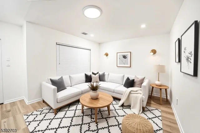 a living room with furniture and a table