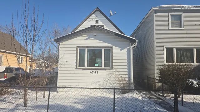 a front view of a house with parking