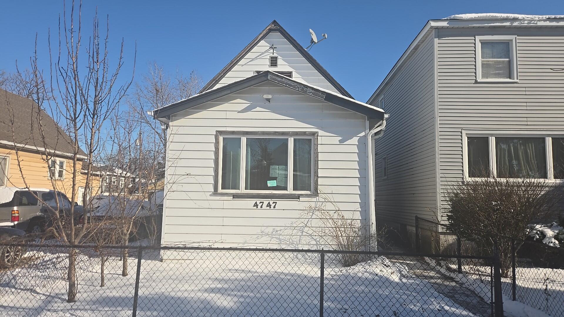 a front view of a house with parking