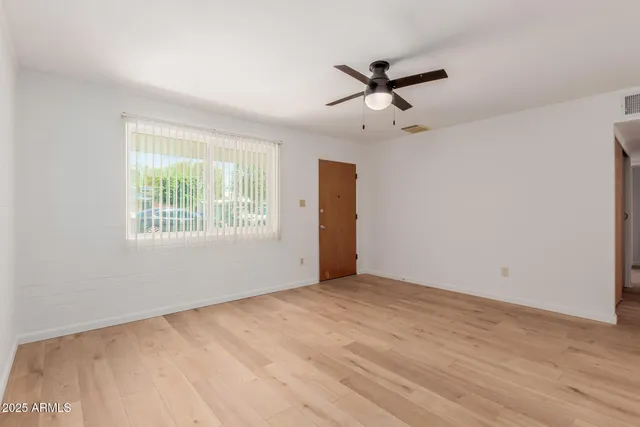 a view of an empty room with a window